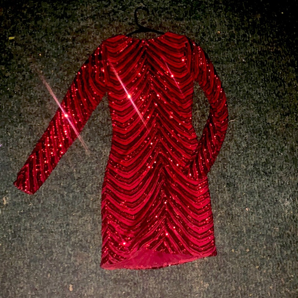 I am selling this beautiful red sparkly dress this dress has only been worn once